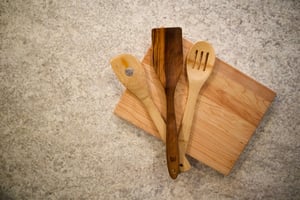 wooden cutting board and wooden utensils hydrated with vermont natural coatings wood rescue oil